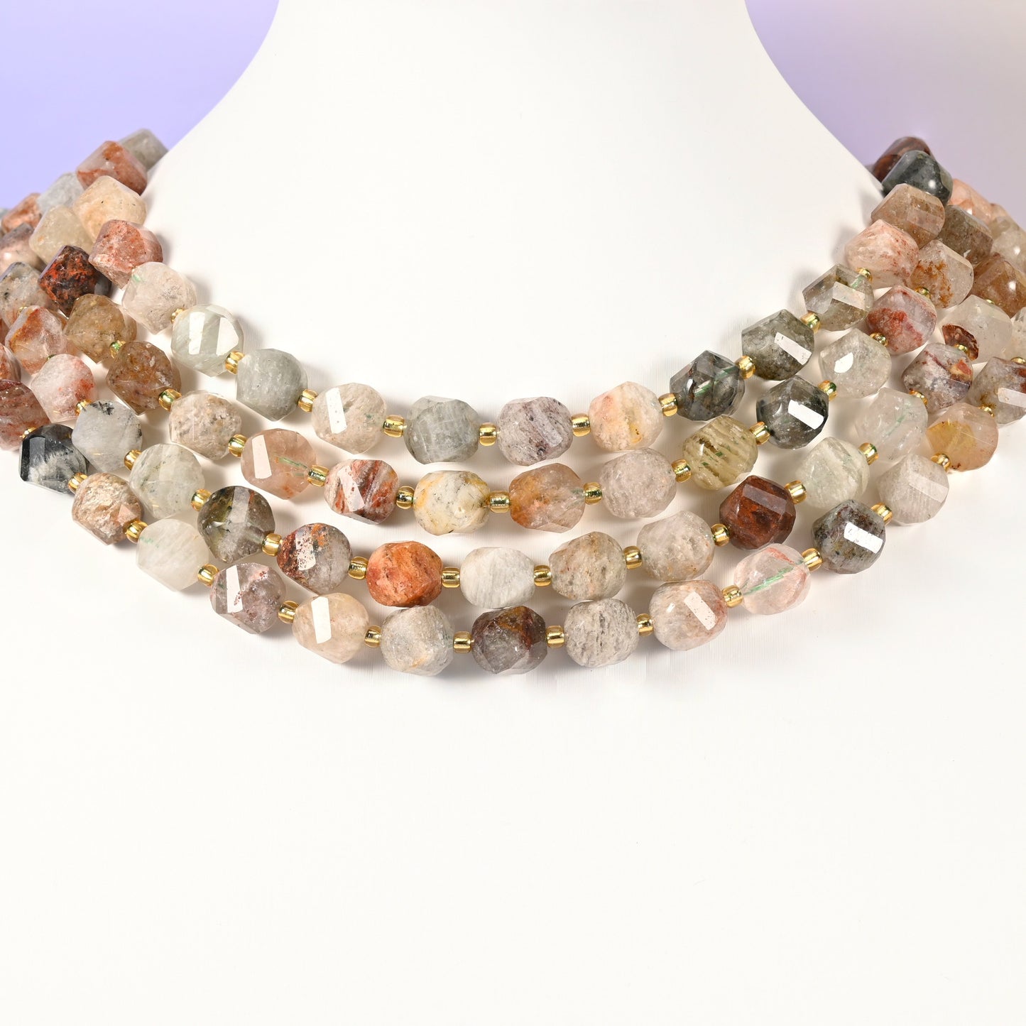 Thousand Layer Phantom Quartz natural crystal beads showing the layered internal phantoms inside the translucent 10mm faceted beads