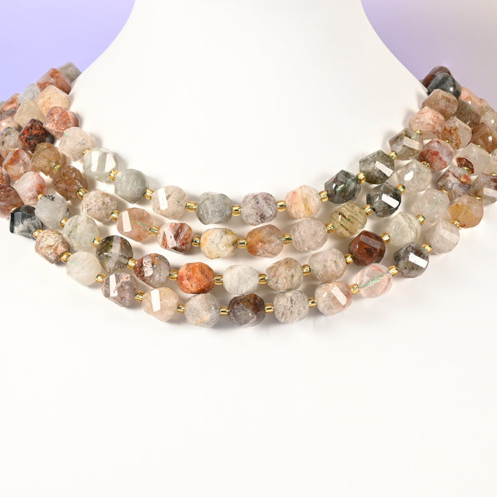 Thousand Layer Phantom Quartz natural crystal beads showing the layered internal phantoms inside the translucent 10mm faceted beads