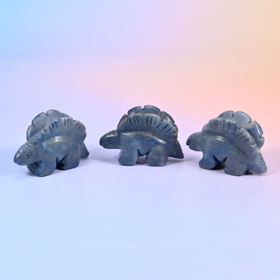 2 inch carved stegosaurus display piece; natural stone, so colour and veining vary from piece to piece
