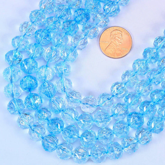 Faceted round cut transparent blue glass beads