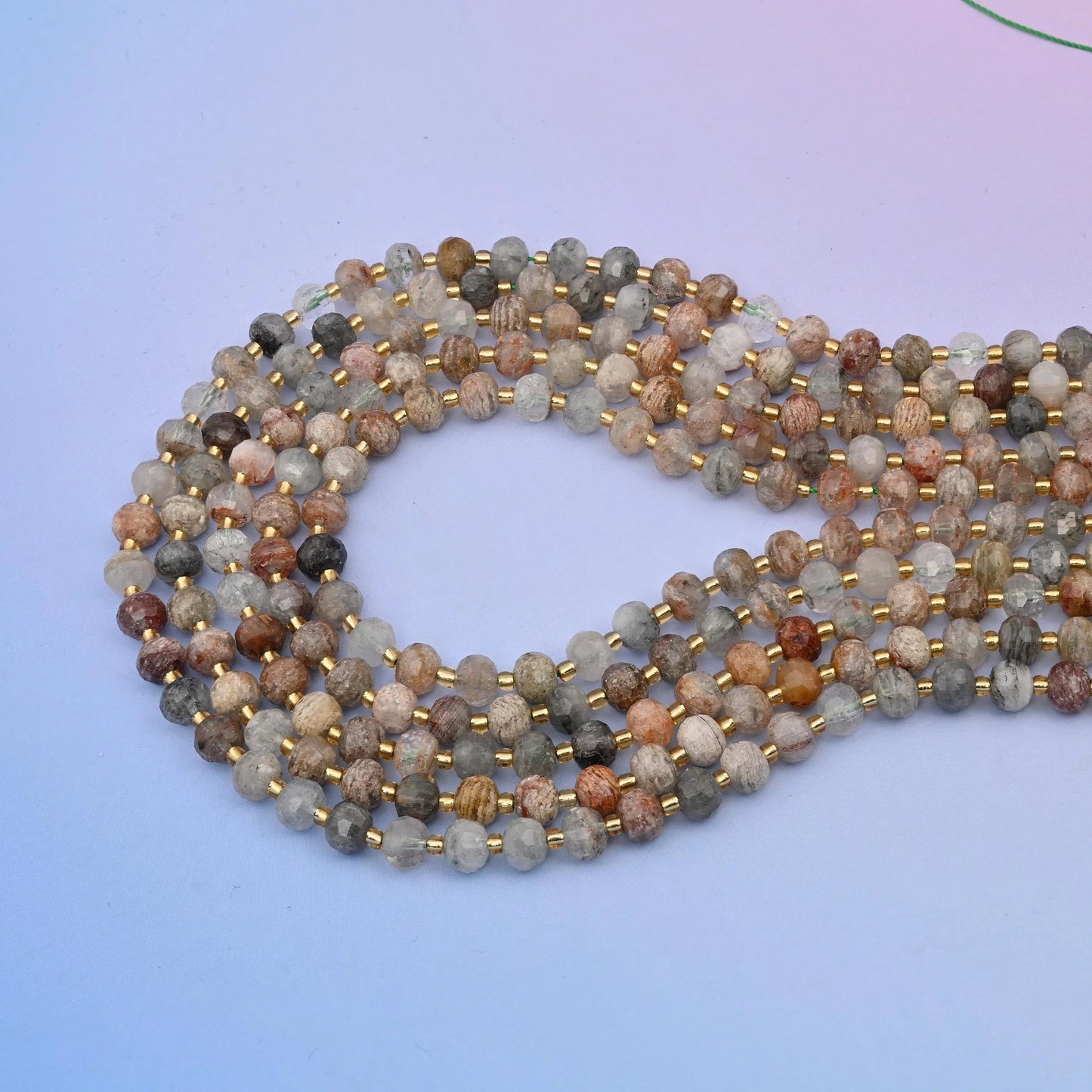 Thousand layer phantom quartz rondelle beads in milky white, smoke grey and honey-tan
