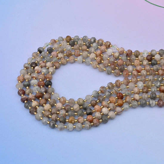 Thousand layer phantom quartz rondelle beads in milky white, smoke grey and honey-tan