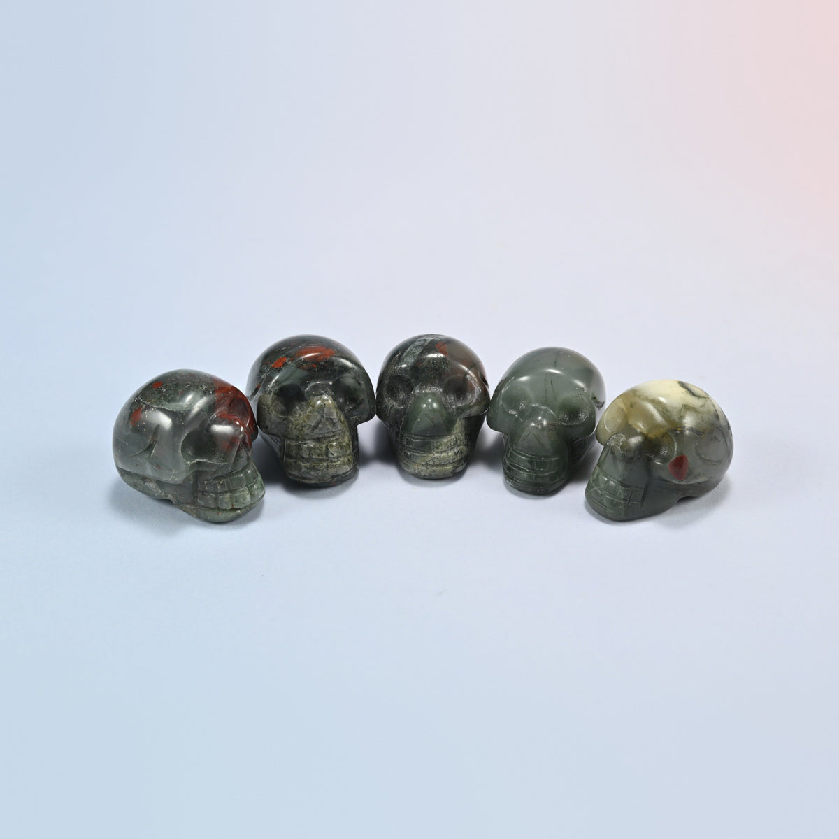 1 inch skull crystal carving in African bloodstone, green and gray natural stone with red spots