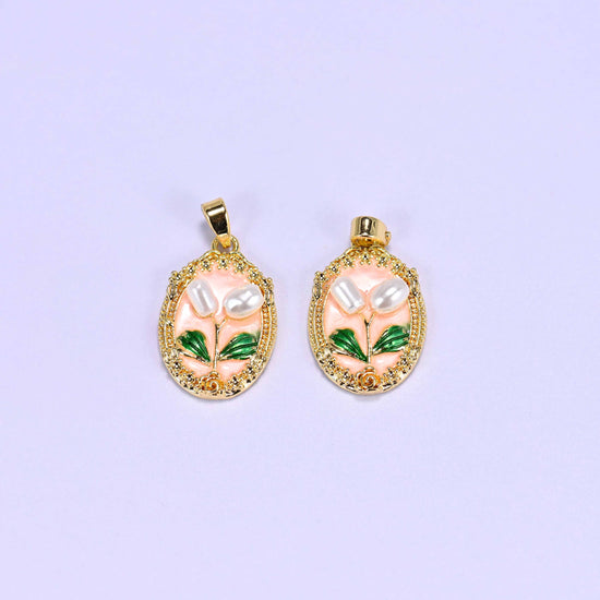 Enamel Oval Tulip Flower Pendants in peach, two gold-plated ovals with faux pearl tulip blooms, green enamel leaves and an ornate gold frame.