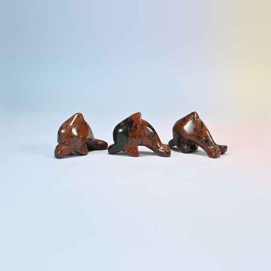 Three golden swan dolphin crystal carvings, 2 inch, black and red-brown natural stone