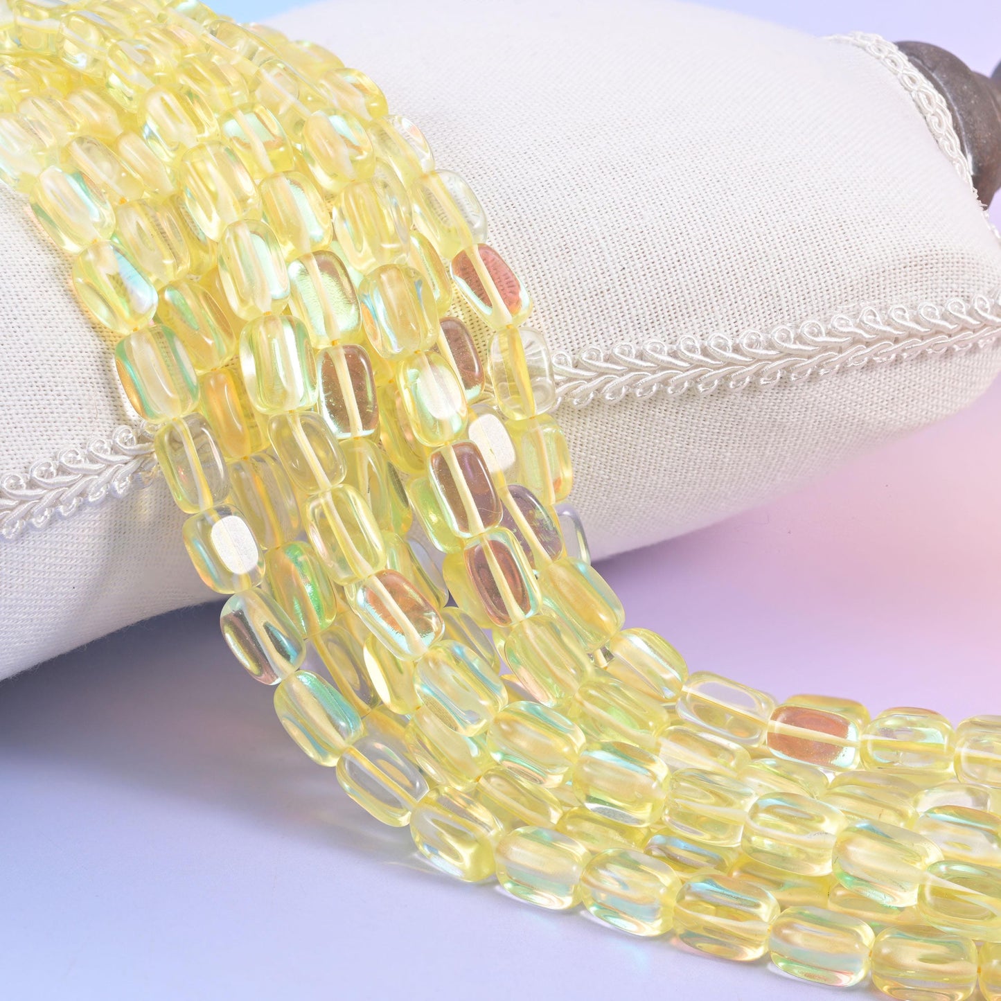 Yellow Mystic Aura glass beads in a rectangular cut with a glossy transparent finish
