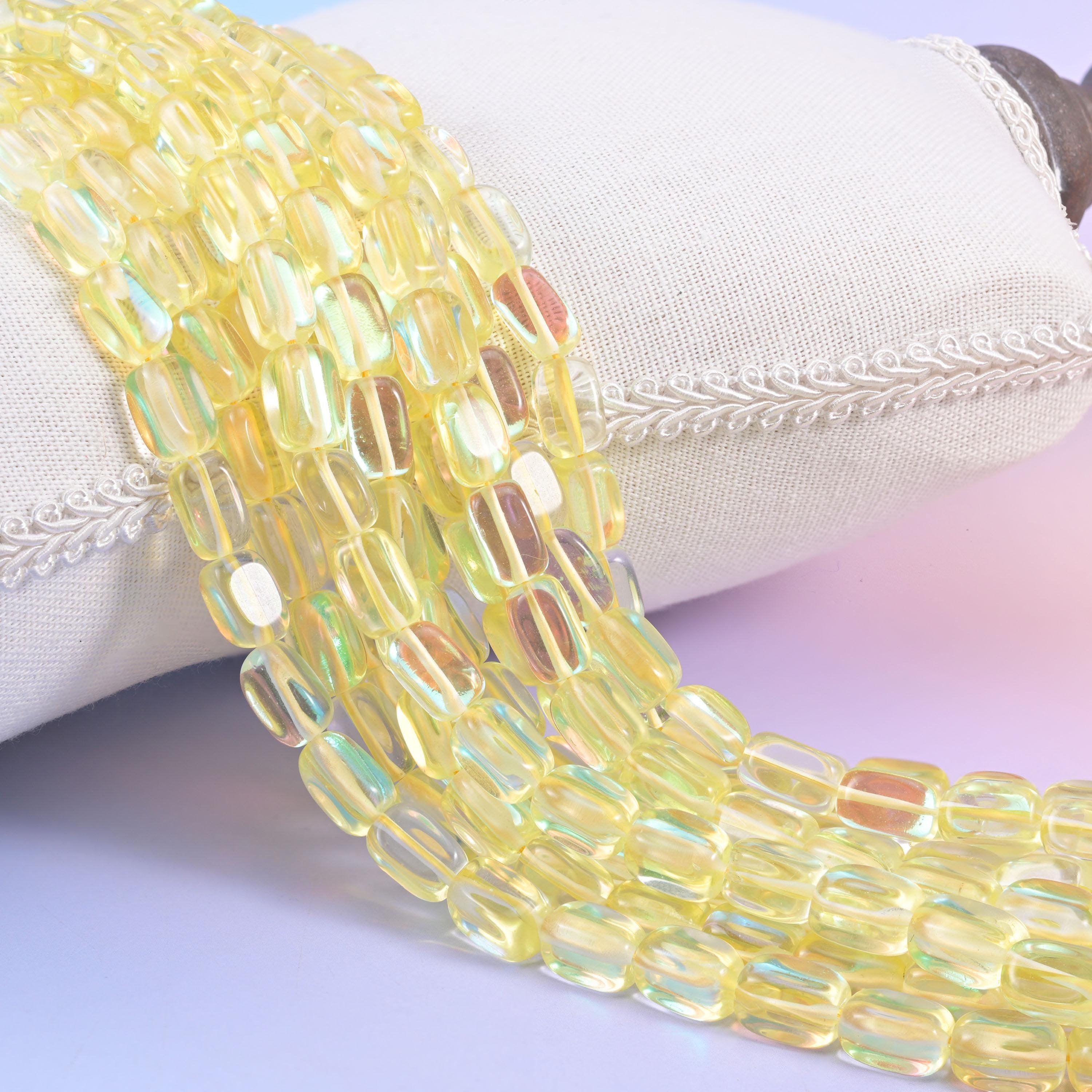 Yellow Mystic Aura glass beads in a rectangular cut with a glossy transparent finish