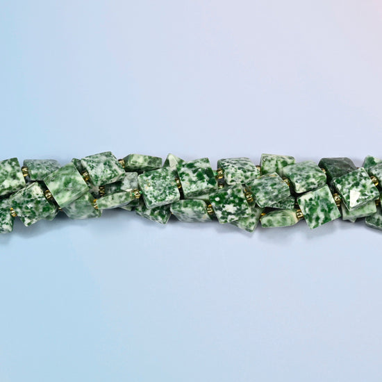 Strands of tree agate faceted flat square beads twisted together in a horizontal row