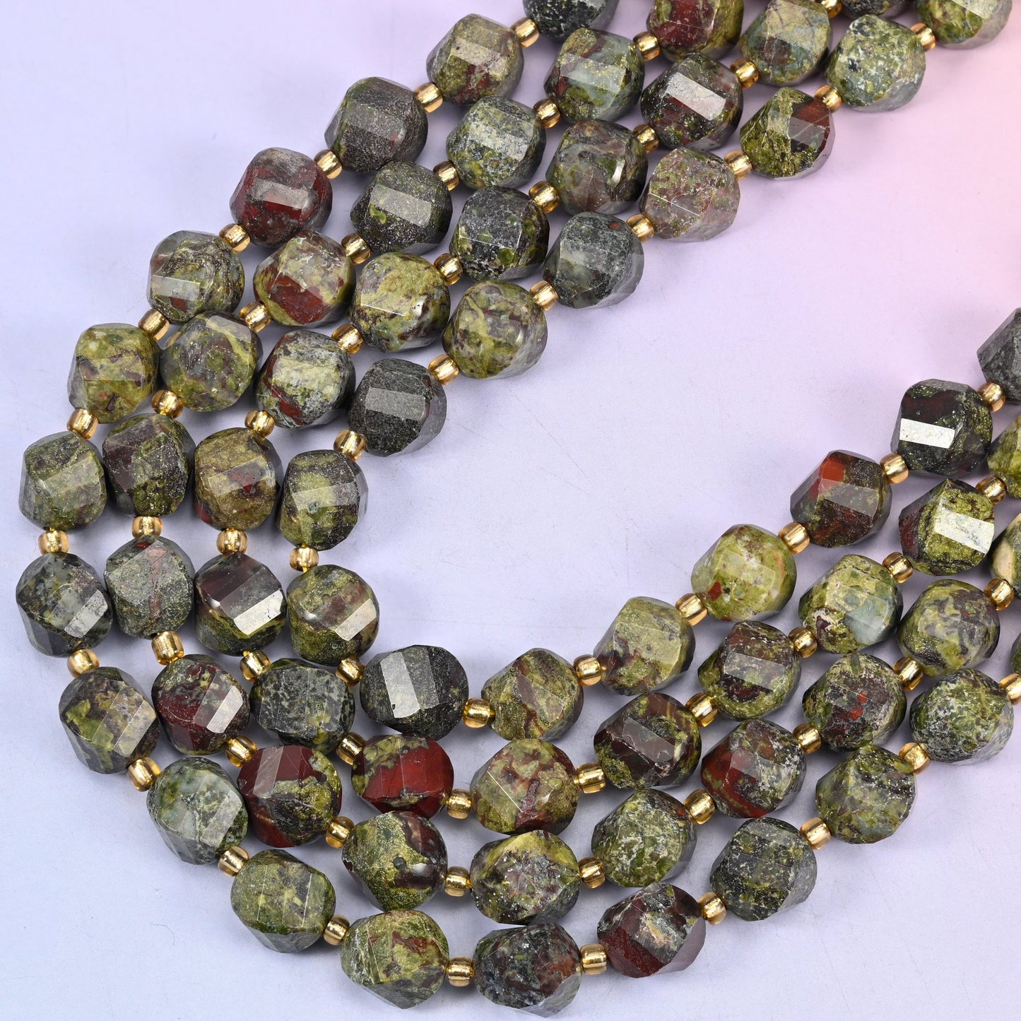 Dragon Bloodstone natural stone beads, many-sided spiral twist cut catching light on every facet, 10mm