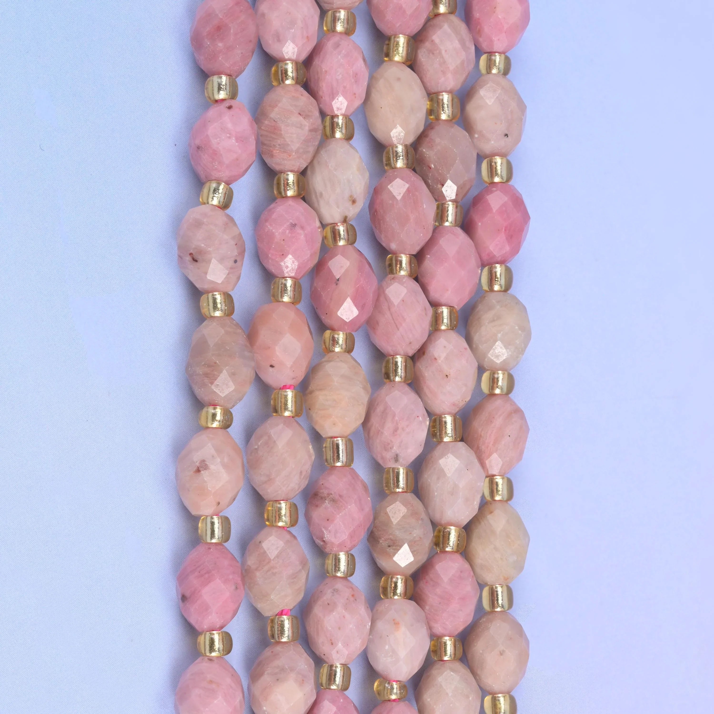 Pink Rhodonite Faceted Rice Barrel Beads, 15.5 inch strand