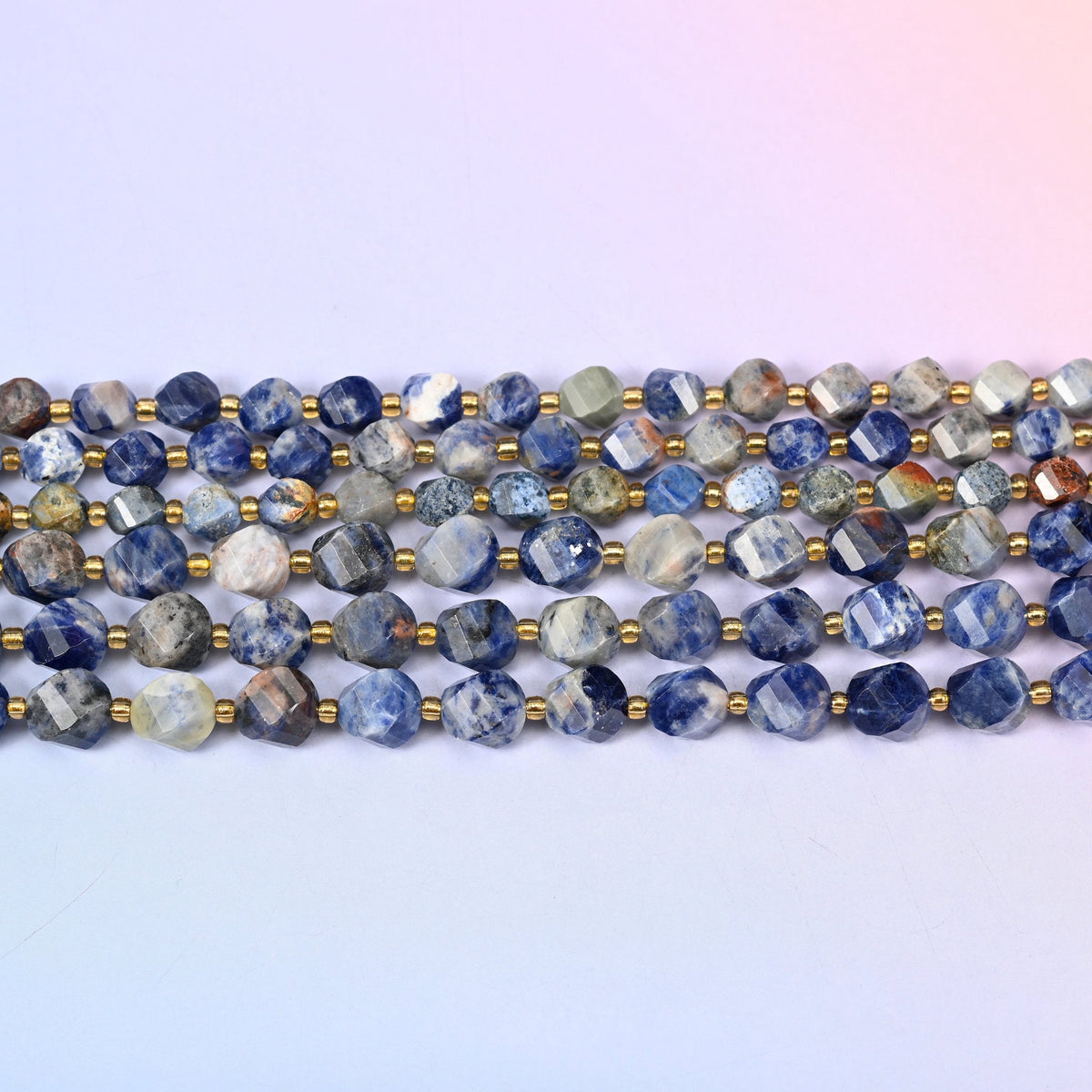 Orange Sodalite beads in deep denim and navy blue marbled with chalky white and rust