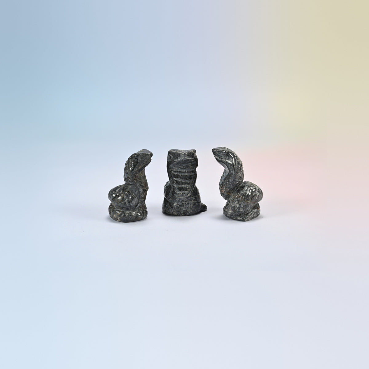Cobra snake crystal carving in gray hematite, metallic gray natural stone