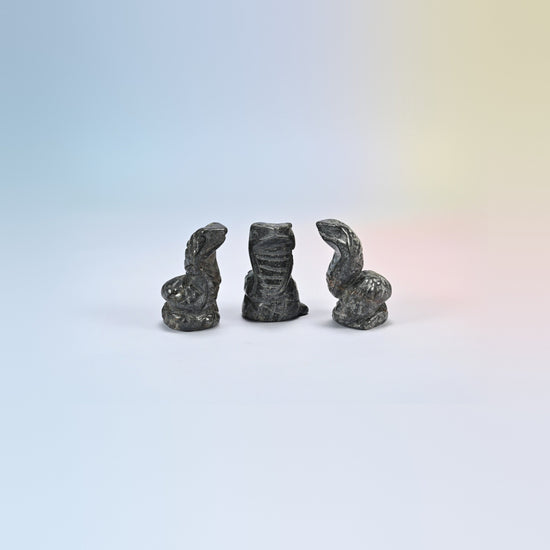 Cobra snake crystal carving in gray hematite, metallic gray natural stone