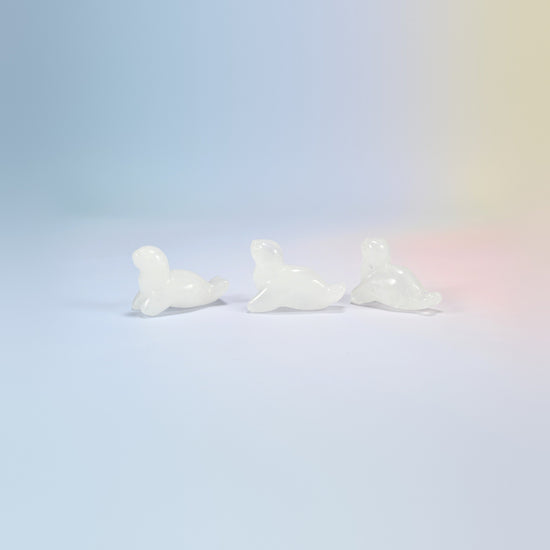 Three clear quartz sea lion crystal carvings, 1.5 inch, milky clear natural stone