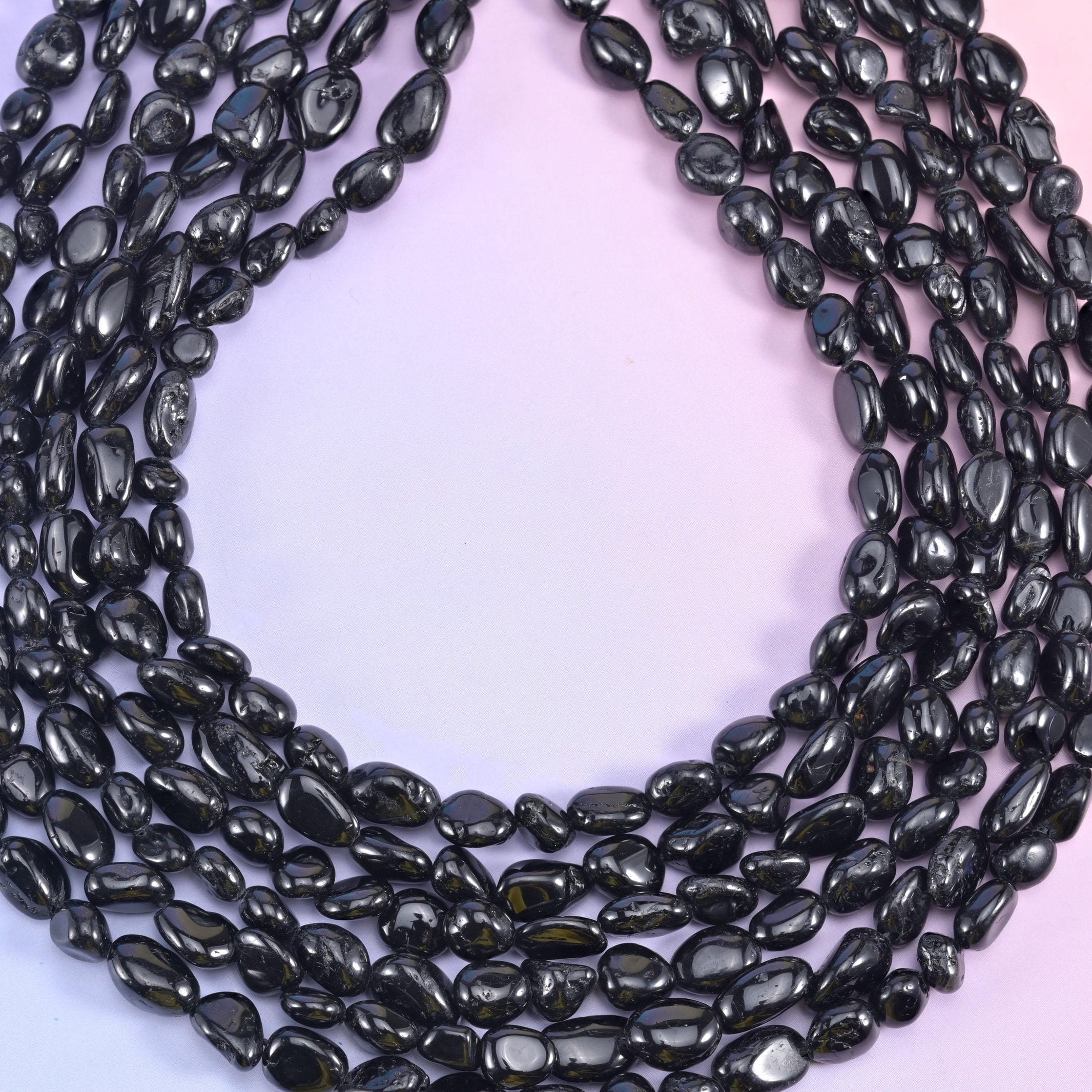Looped black tourmaline nugget strands showing the full 15.5 inch length