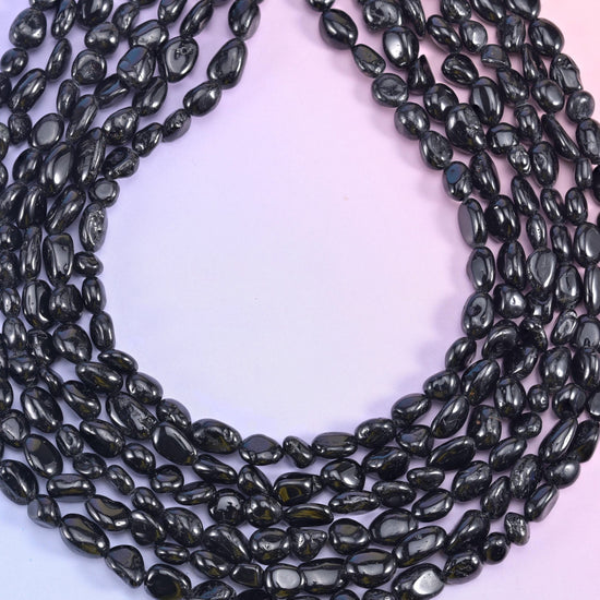 Looped black tourmaline nugget strands showing the full 15.5 inch length