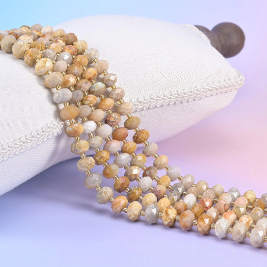 Fossil Coral faceted rondelle beads in warm earthy brown with natural coral fossil patterning