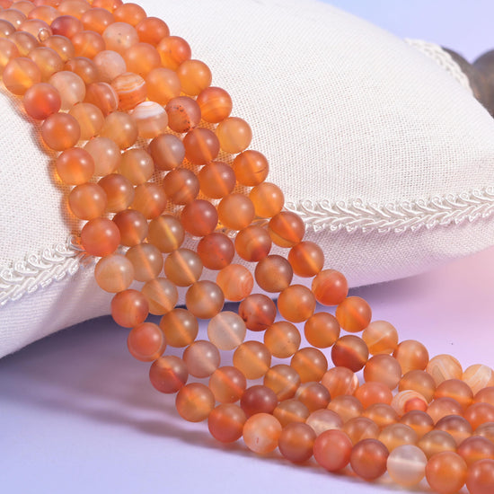 Orange Carnelian matte round beads in warm apricot to deep russet orange