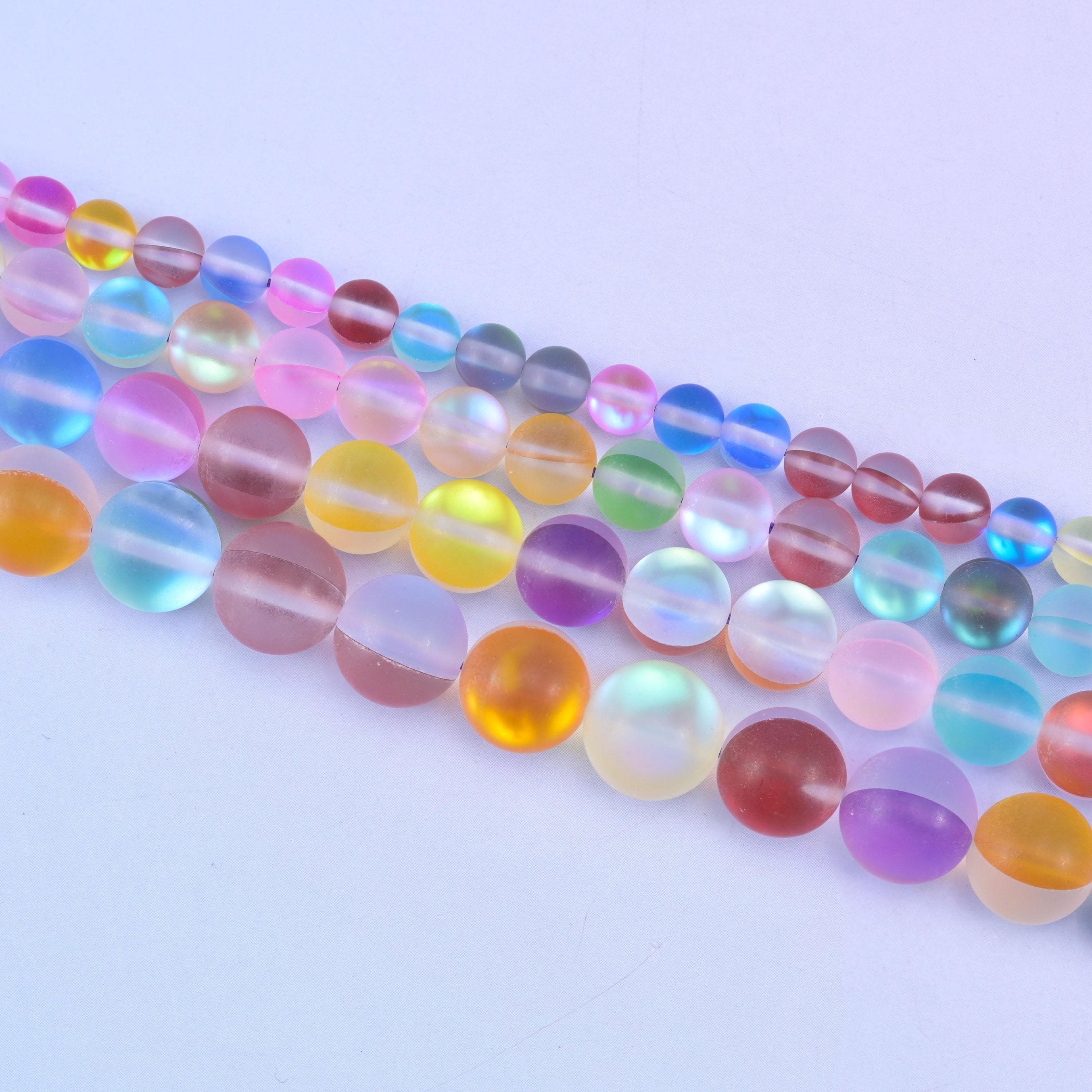 Rainbow aura beads in mixed pastel pink, sky blue, lilac and mint tones