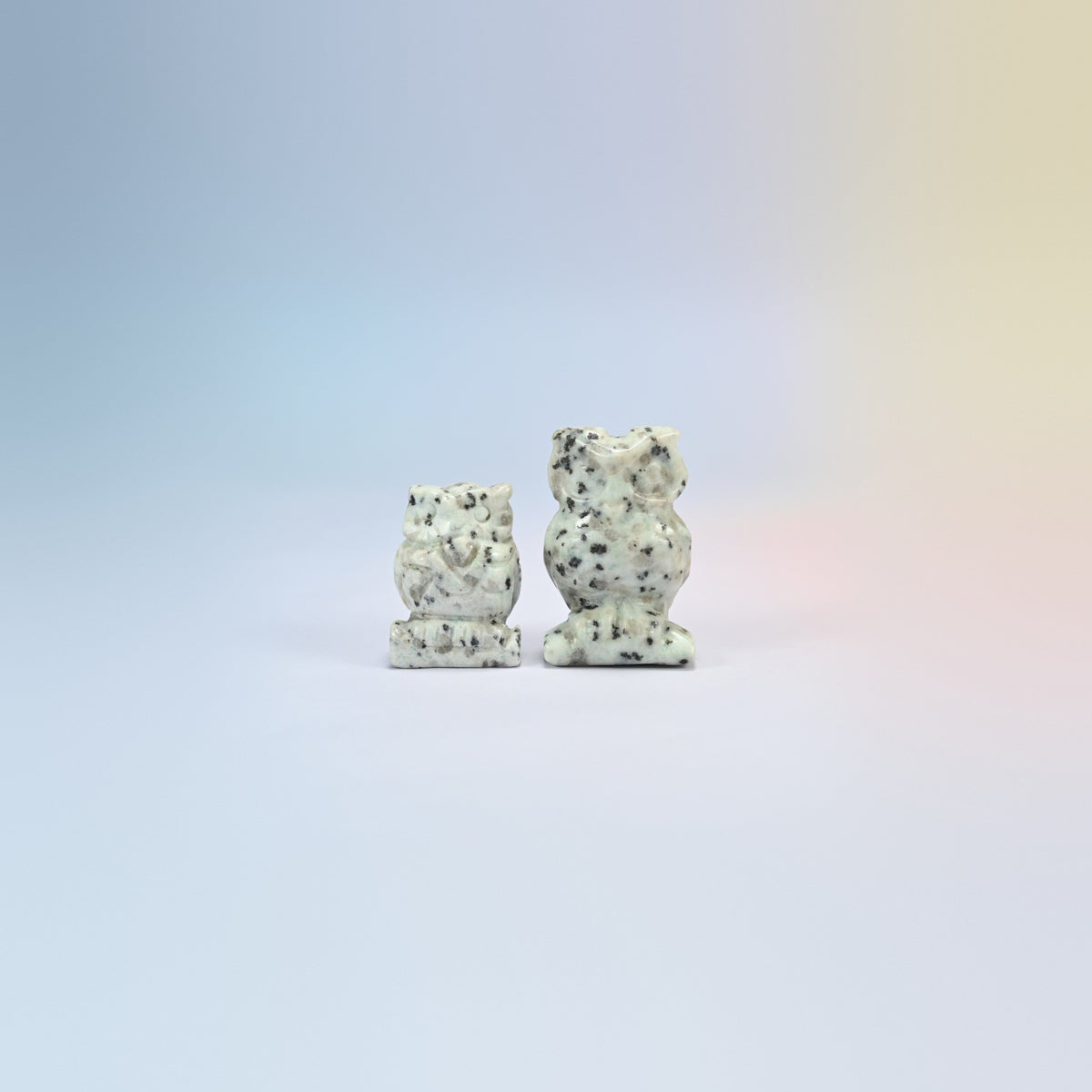 Owl crystal carving in kiwi jasper, white and green natural stone with black spots