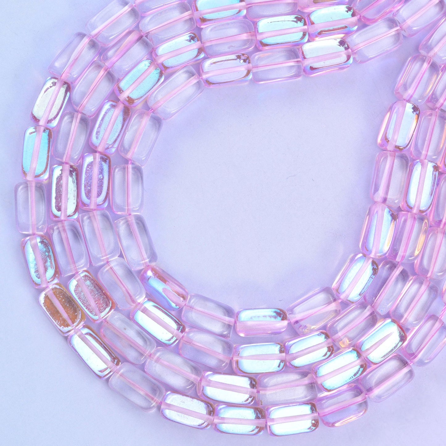 Light purple mystic aura glass beads, approximately 34 beads per strand