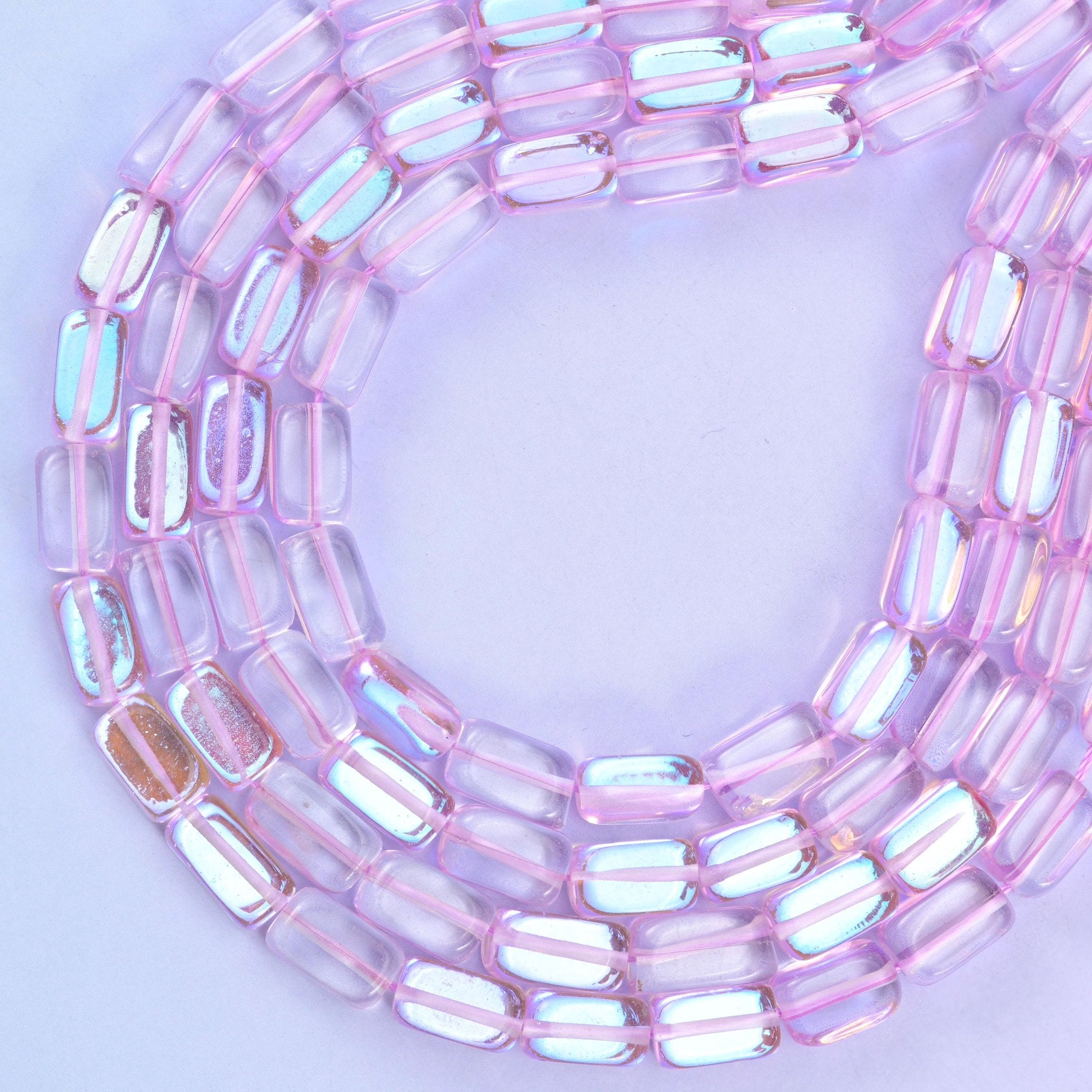 Light purple mystic aura glass beads, approximately 34 beads per strand