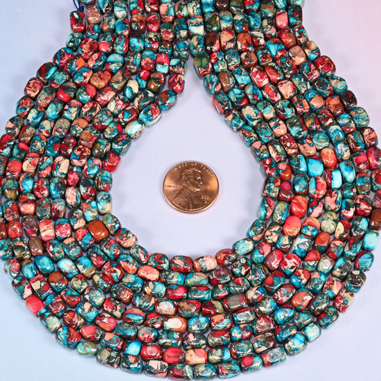 Small rounded dyed Sea Sediment Jasper nuggets in bright turquoise blue and hot brick red with cream and dark mineral veining