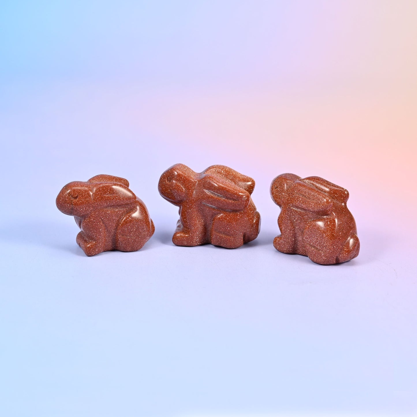 Laying down bunny carving offered in 47 gemstones, from deep green and cream to lilac, coral and blue
