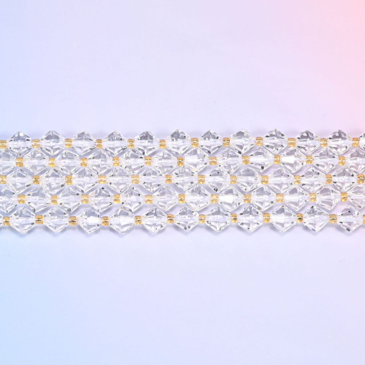 A single straight strand of 8mm Clear Quartz faceted bicone beads laid flat, showing the full 15 inch length.