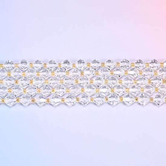A single straight strand of 8mm Clear Quartz faceted bicone beads laid flat, showing the full 15 inch length.