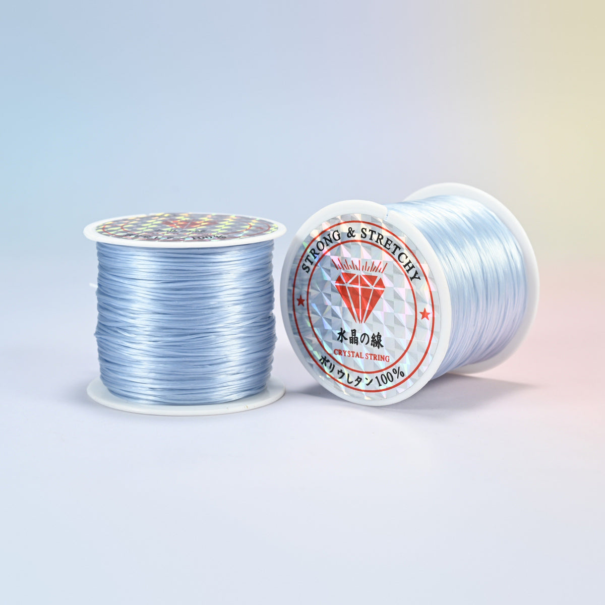 Two rolls of gray blue 0.7-0.8mm elastic stretch string, glossy polyurethane bead cord with a holographic label