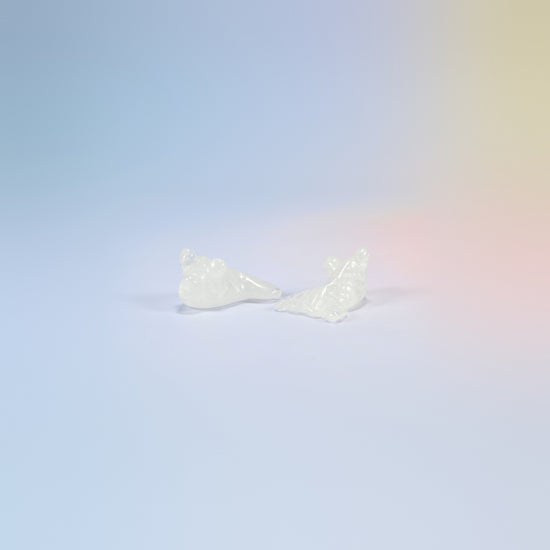 Two 1.5 inch natural clear quartz goldfish carvings, white and icy clear