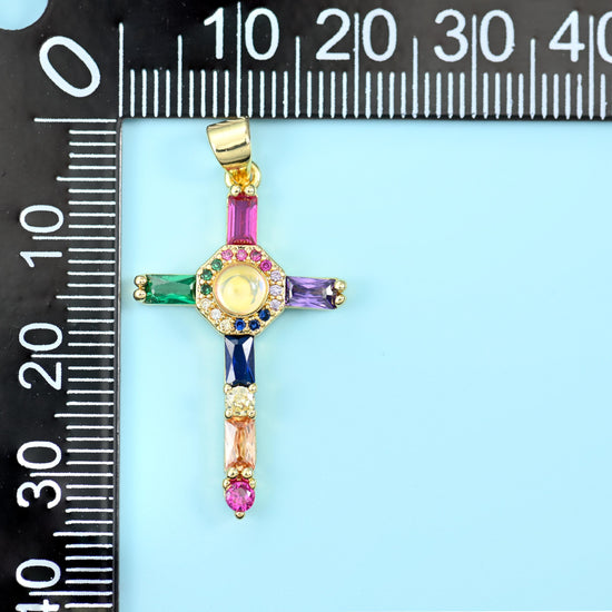 18K gold plated cross zirconia pendant on a black millimetre ruler, measuring about 35mm including the bail.