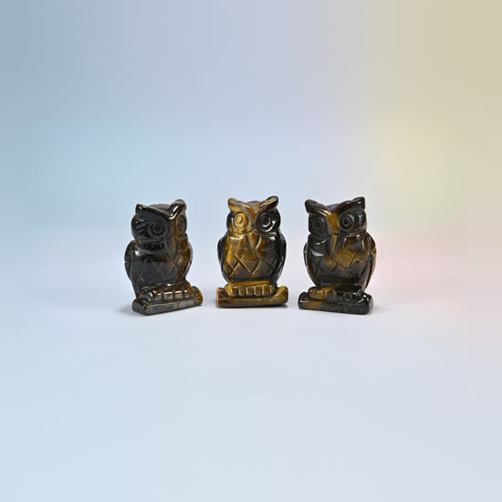 Owl crystal carving in tiger eye, golden brown natural stone with shimmering bands