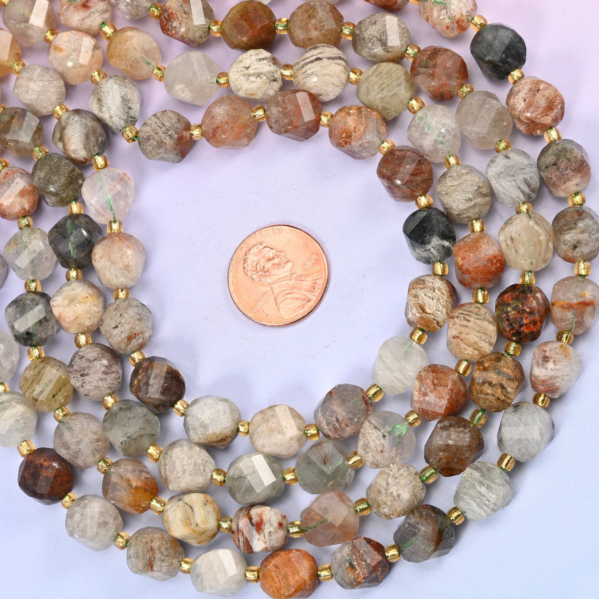 Thousand Layer Phantom Quartz natural crystal beads, 10mm faceted spiral twist beads on a full 15 inch strand