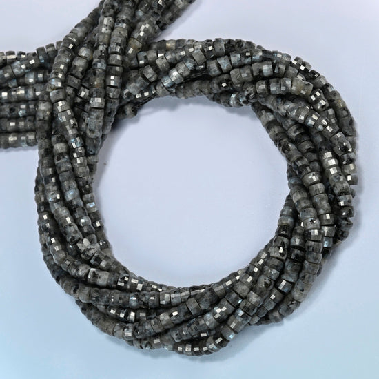 Black labradorite faceted heishi disc beads coiled into overlapping loops, whole strands of smoky gray stone