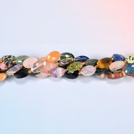Strands of assorted gemstone faceted flat oval beads twisted together in a horizontal row