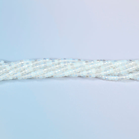 Strands of opalite faceted heishi disc beads twisted together in a horizontal row