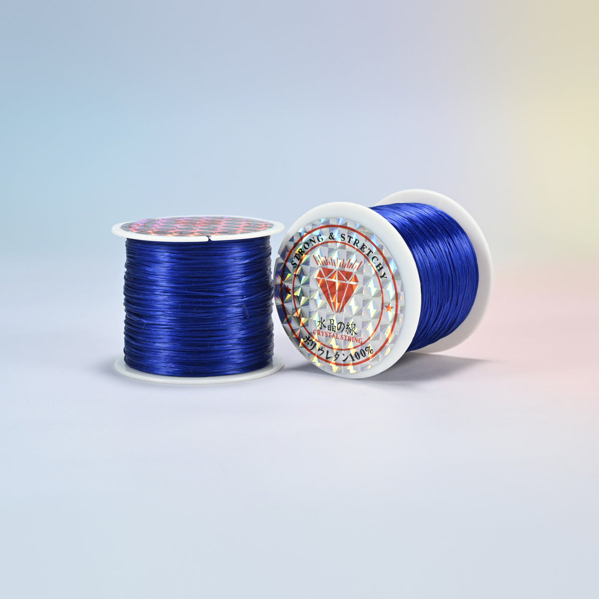 Two rolls of royal blue 0.7-0.8mm elastic stretch string, glossy polyurethane bead cord with a holographic label