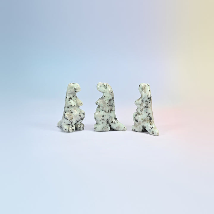 Three kiwi jasper T-Rex dinosaur crystal carvings, 2 inch, cream natural stone with dark spots
