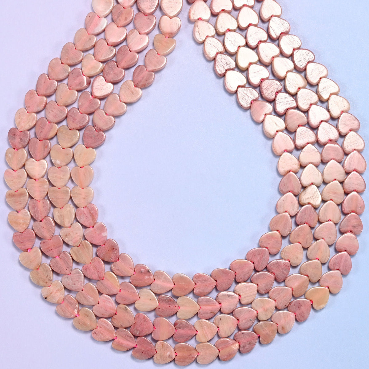Flat heart cut pink rhodonite beads