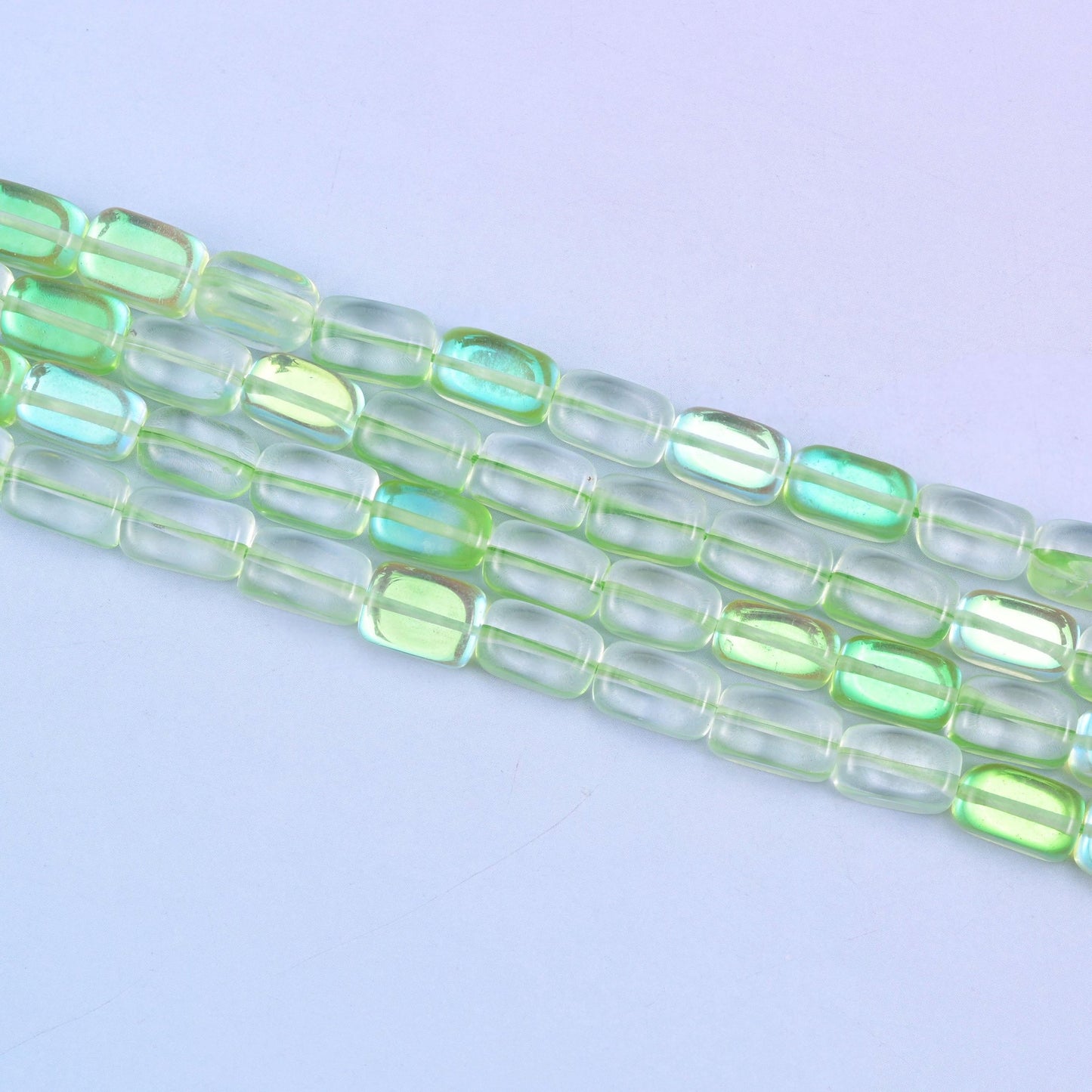 Green Mystic Aura glass beads in a fresh lime-green shine with a subtle iridescent glow