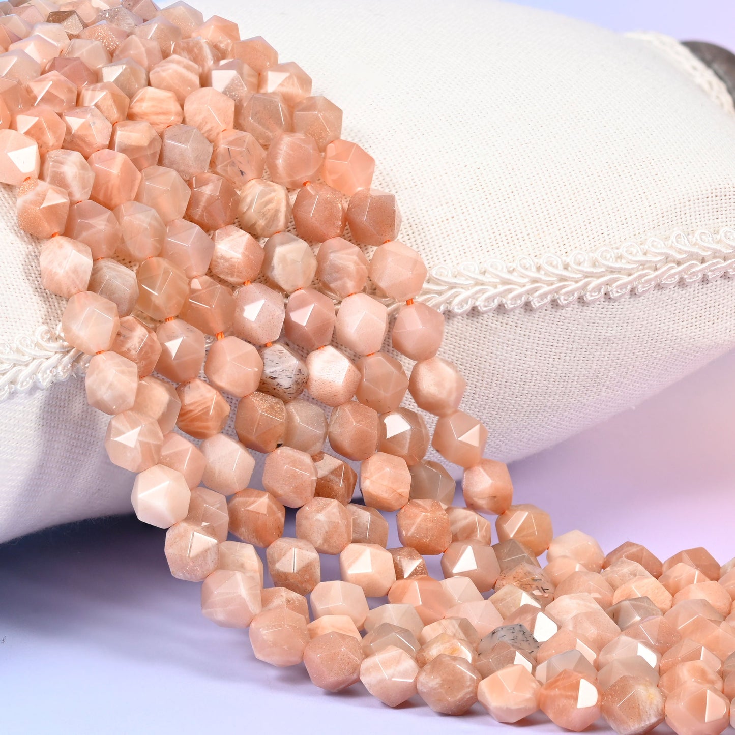 Sunstone diamond star cut beads in soft apricot and peach with a golden shimmer