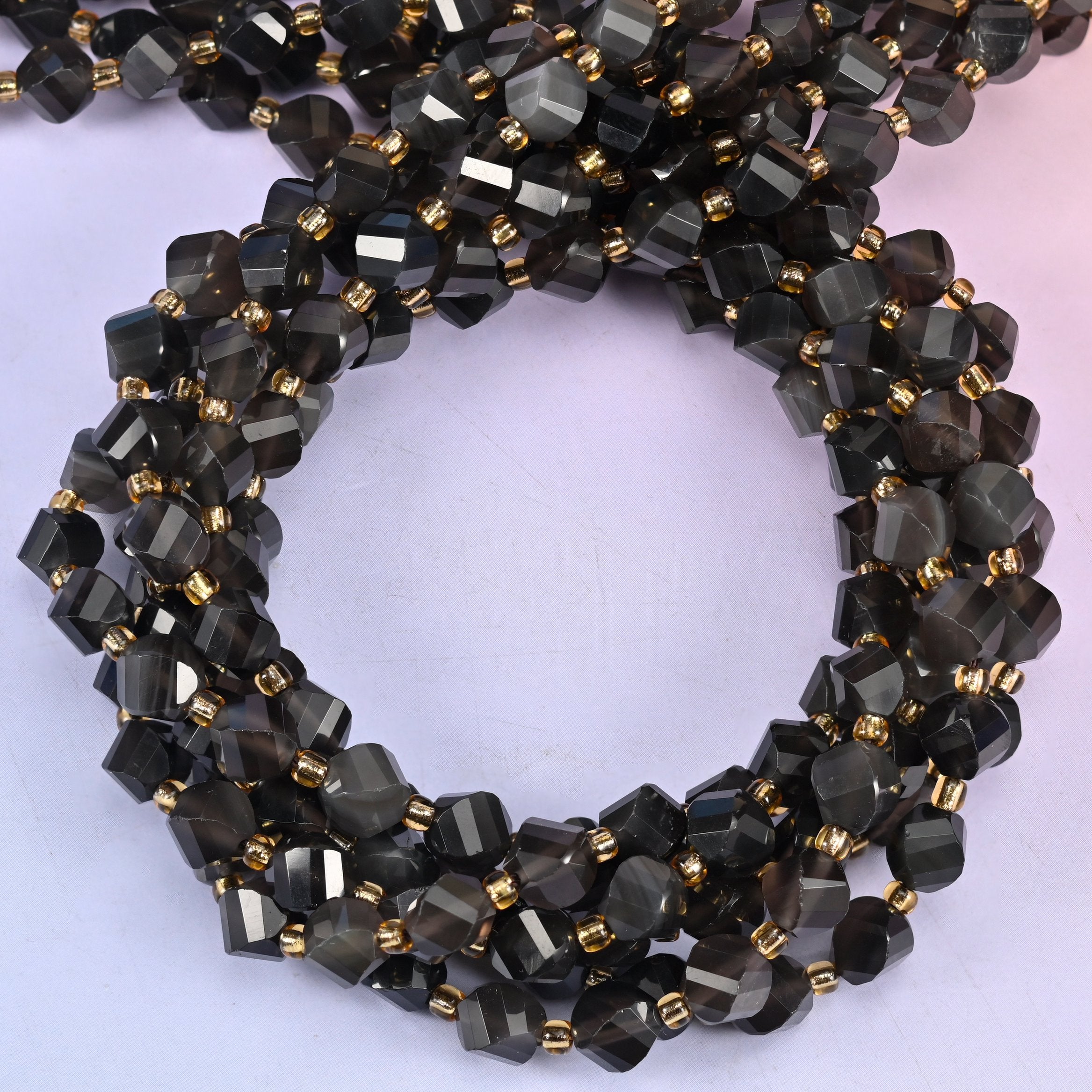 Ice obsidian natural stone beads, 8mm faceted spiral twist, each bead carrying its own depth of smoke