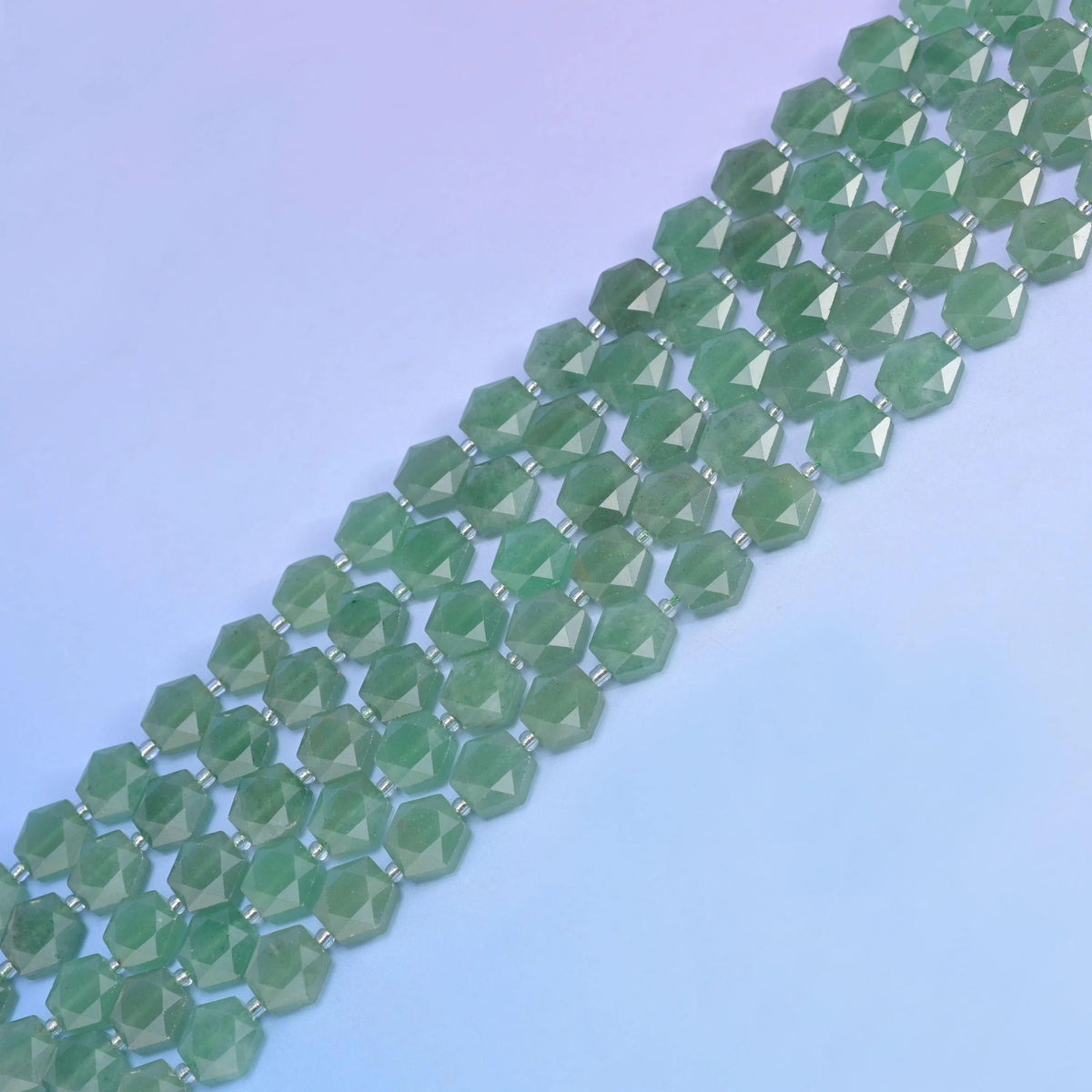 Green Aventurine in medium sage green with darker mottling.