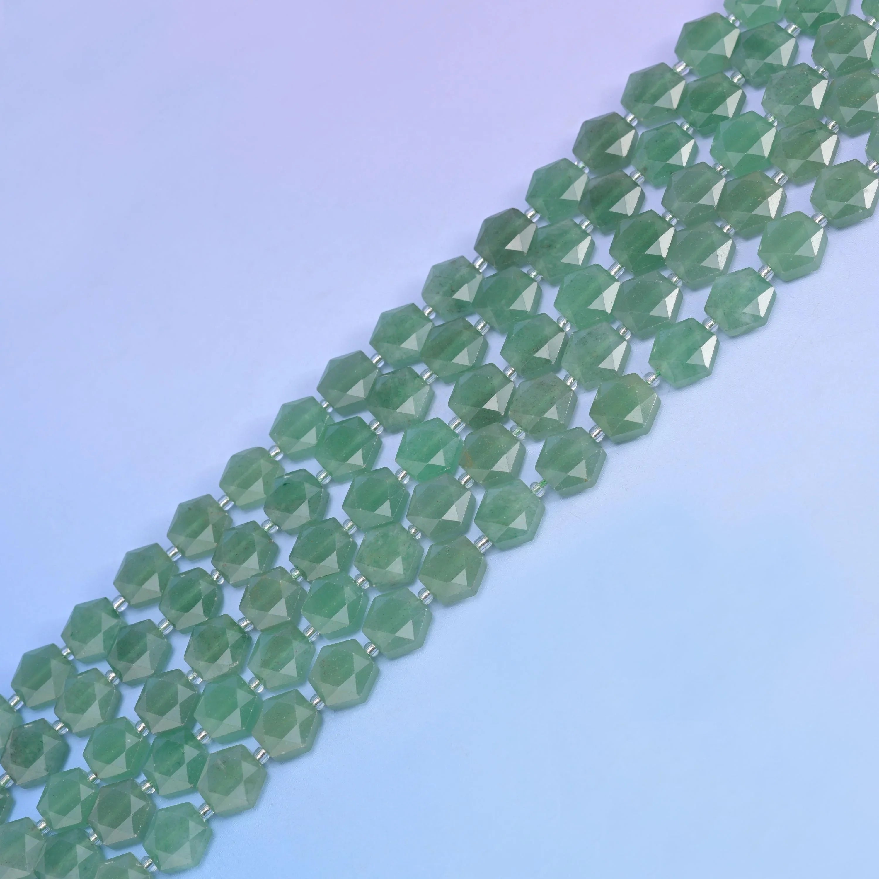 Green Aventurine in medium sage green with darker mottling.