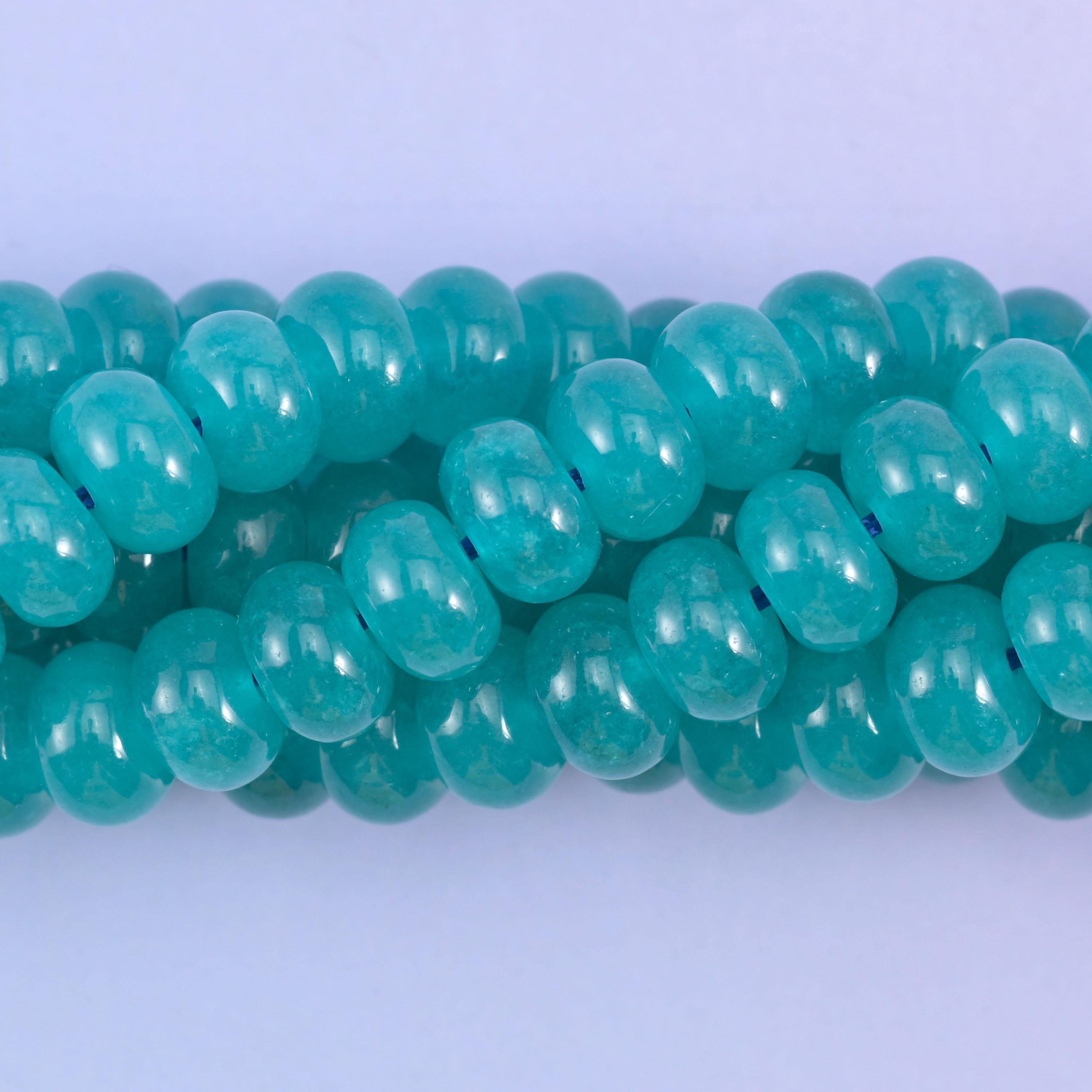 Smooth rondelle cut dyed jade beads with a polished surface
