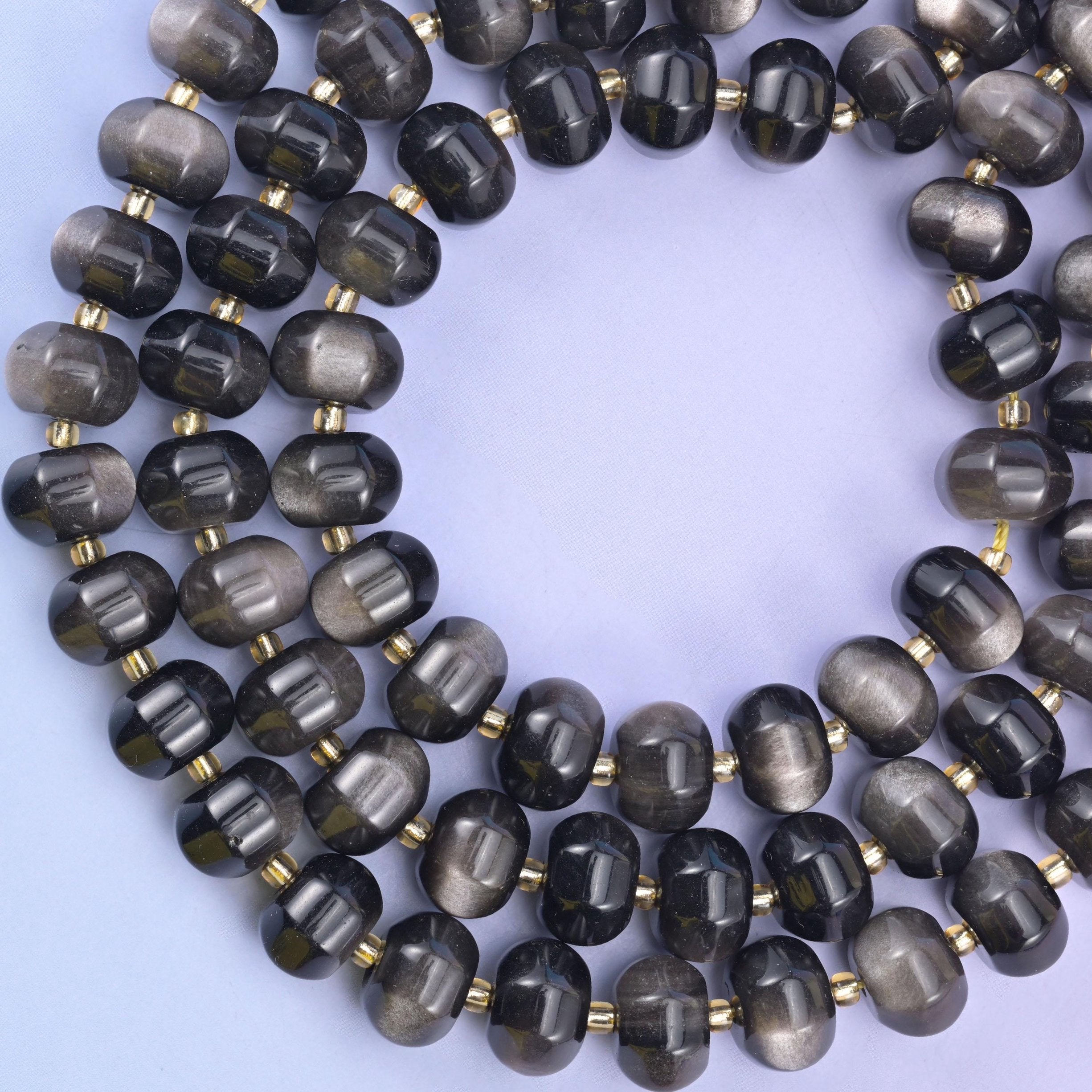 Silver obsidian pumpkin beads, approximately 35 beads per strand