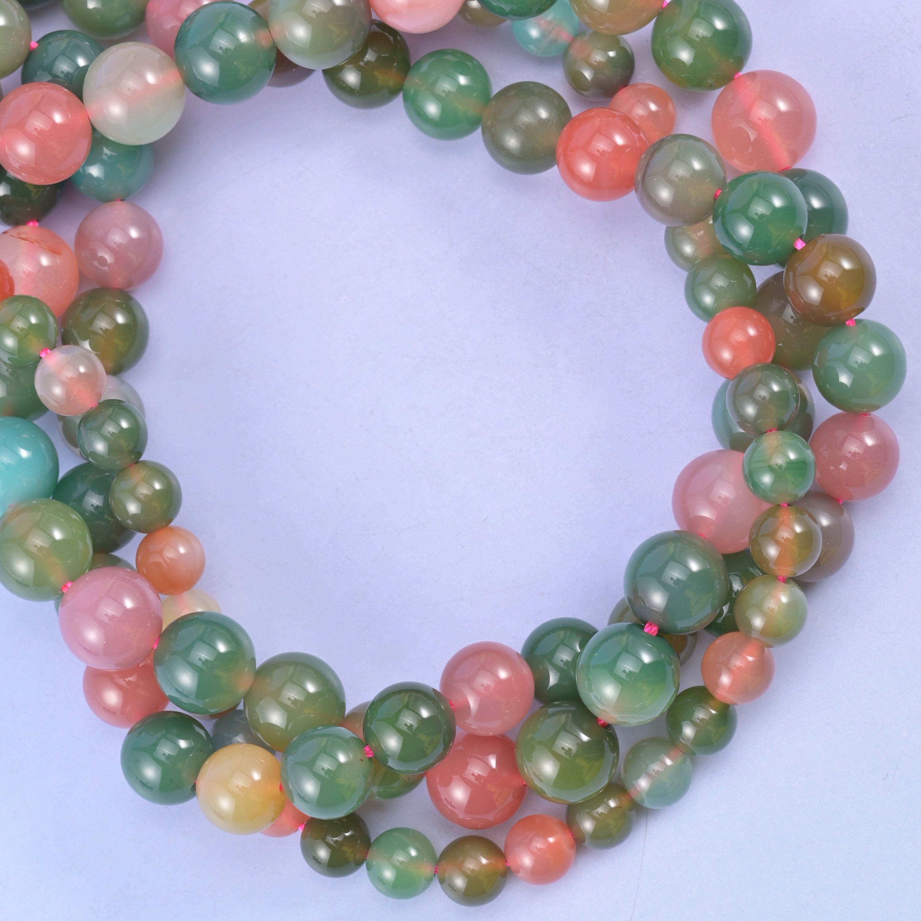 Green Yanyuan Agate smooth round beads coiled into a ring, mixed sizes offered in 6mm, 8mm and 9mm