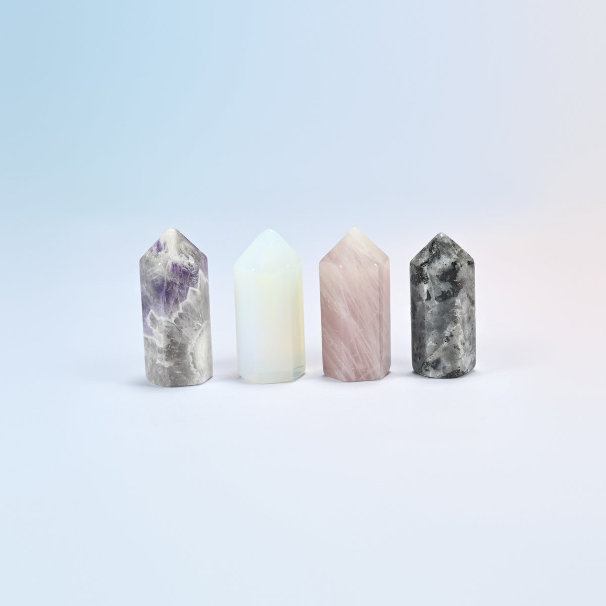 Four 1.4 inch small hexagon crystal points standing in natural amethyst, opalite, natural rose quartz and natural black labradorite